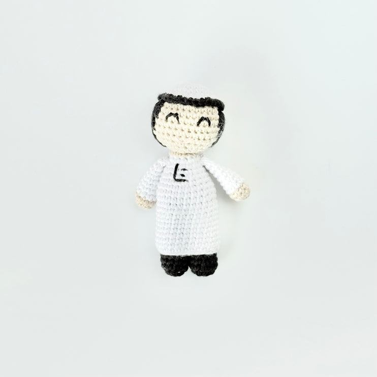 mini crochet doll of boy in thobe 