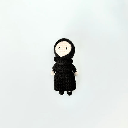 mini crochet doll of girl in abaya 